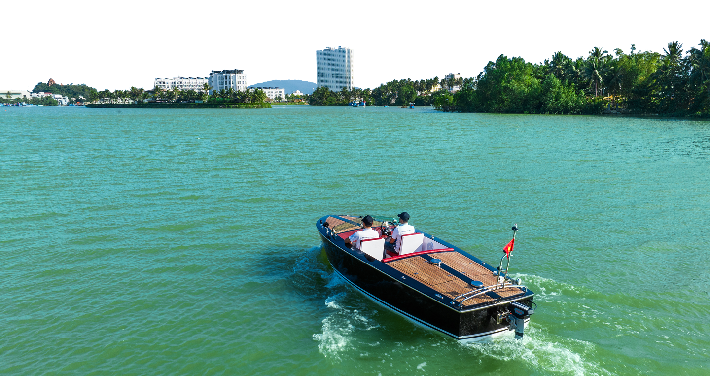 Blue boat on green water